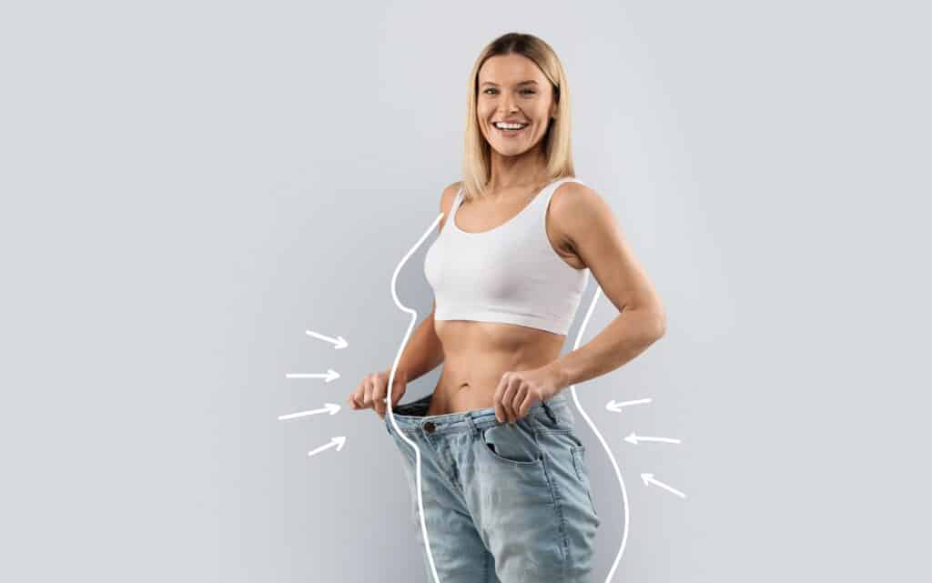 Smiling woman in loose jeans showing weight loss, with white outline and arrows indicating body contouring changes